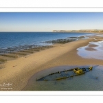 France, Pas-de-Calais (62), côte d'Opale, Grand site des deux caps, La plage de Tardinghen avec ses bouchots pour la culture des moules, le cap blanc-nez en arrière plan et l’épave du Lord Grey, ce chalutier britannique, long de 37 mètres, réquisitionné en 1915 par la Royal Navy et transformé en démineur, qui a sombré le 2 décembre 1917 lors d'une tempête  (Vue aérienne)// France, Pas-de-Calais (62), Opal Coast, Great site of the two capes, Tardinghen beach with its bouchots for mussel farming, the Cap Blanc-Nez in the background and the wreck of the Lord Grey, this 37-meter long British trawler, requisitioned in 1915 by the Royal Navy and transformed into a mine-clearer, which sank on December 2, 1917 during a storm (aerial view)