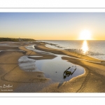 France, Pas-de-Calais (62), côte d'Opale, Grand site des deux caps, La plage de Tardinghen, ses bouchots pour la culture des moules, le cap Gris-nez en arrière plan au soleil couchant et l’épave du Lord Grey, ce chalutier britannique, long de 37 mètres, réquisitionné en 1915 par la Royal Navy et transformé en démineur, qui a sombré le 2 décembre 1917 lors d'une tempête  (Vue aérienne) // France, Pas-de-Calais (62), Opal Coast, Great site of the two capes, the beach of Tardinghen, its bouchots for the culture of mussels, the Cap Gris-nez in the background at sunset and the wreck of the Lord Grey, this British trawler, 37 meters long, requisitioned in 1915 by the Royal Navy and transformed into a mine-clearer, which sank on December 2, 1917 during a storm (aerial view)