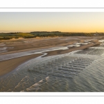 France, Pas-de-Calais (62), côte d'Opale, Grand site des deux caps, La plage de Tardinghen, ses bouchots pour la culture des moules, le cap Gris-nez en arrière plan au soleil couchant et l’épave du Lord Grey, ce chalutier britannique, long de 37 mètres, réquisitionné en 1915 par la Royal Navy et transformé en démineur, qui a sombré le 2 décembre 1917 lors d'une tempête  (Vue aérienne) // France, Pas-de-Calais (62), Opal Coast, Great site of the two capes, the beach of Tardinghen, its bouchots for the culture of mussels, the Cap Gris-nez in the background at sunset and the wreck of the Lord Grey, this British trawler, 37 meters long, requisitioned in 1915 by the Royal Navy and transformed into a mine-clearer, which sank on December 2, 1917 during a storm (aerial view)