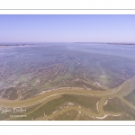 France, Somme (80), Baie de Somme, Saint-Valery-sur-Somme, Cap Hornu, les mollières envahies par la mer lors des grandes marées, les chenaux et les mares des huttes de chasse sont alors bien visibles (vue aérienne) // France, Somme (80), Somme Bay, Saint-Valery-sur-Somme, Cape Hornu, the salted meadows invaded by the sea during high tides, the channels and the ponds of hunting huts are then clearly visible (aerial view)