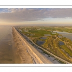 France, Somme (80), Baie de Somme, Cayeux-sur-mer, Ault, Le Hâble d'Ault, cet ancien port est devenu un polder protégé de la mer par le cordon de galets qui forme une digue  (vue aérienne) // France, Somme (80), Baie de Somme, Cayeux-sur-mer, Ault, Le Hâble d'Ault, this old port has become a polder protected from the sea by the pebble cord that forms a dike.  (aerial view)