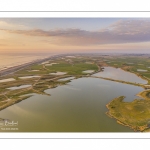 France, Somme (80), Baie de Somme, Cayeux-sur-mer, Ault, Le Hâble d'Ault, cet ancien port est devenu un polder protégé de la mer par le cordon de galets qui forme une digue  (vue aérienne) // France, Somme (80), Baie de Somme, Cayeux-sur-mer, Ault, Le Hâble d'Ault, this old port has become a polder protected from the sea by the pebble cord that forms a dike.  (aerial view)